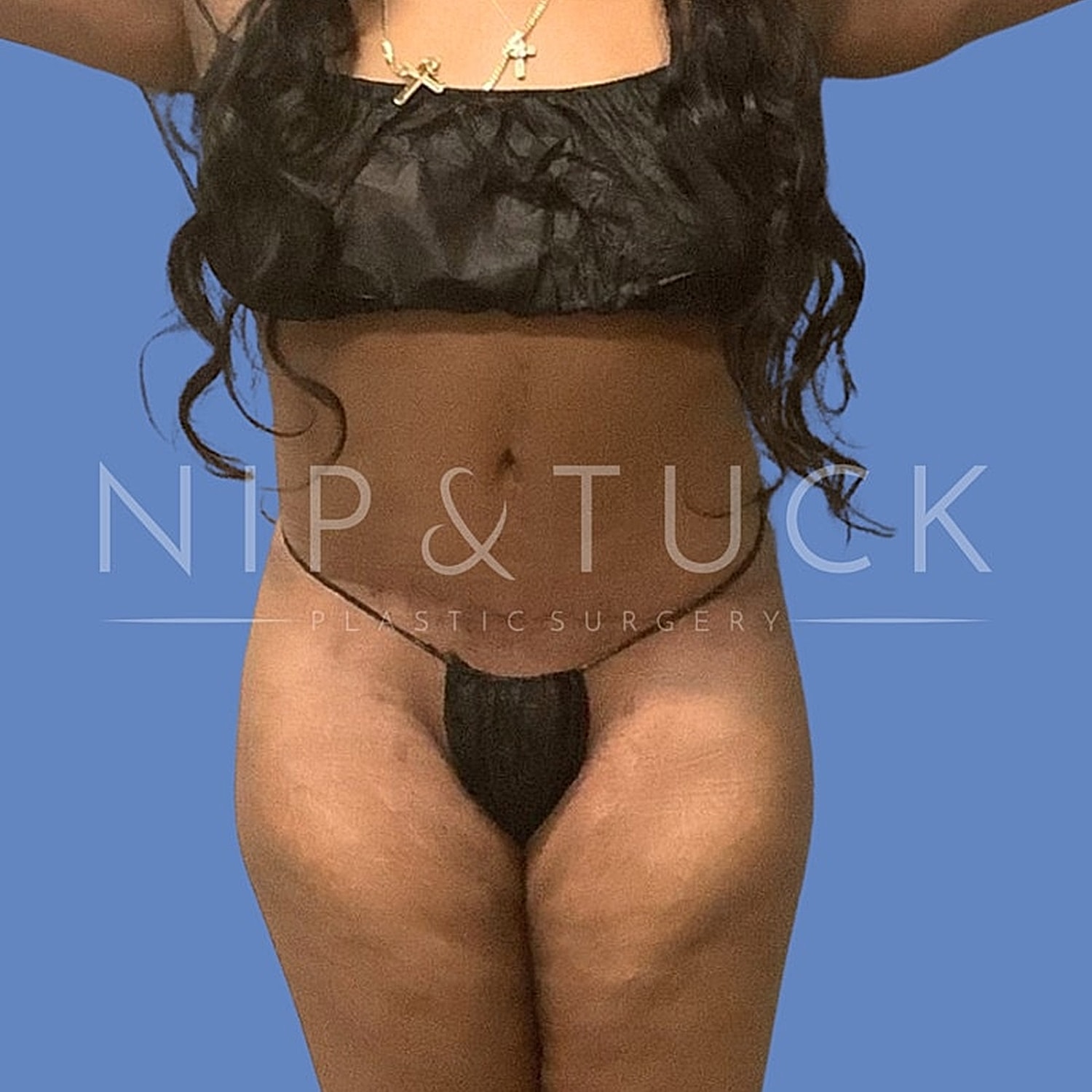 Model showcasing body confidence and intimate apparel.