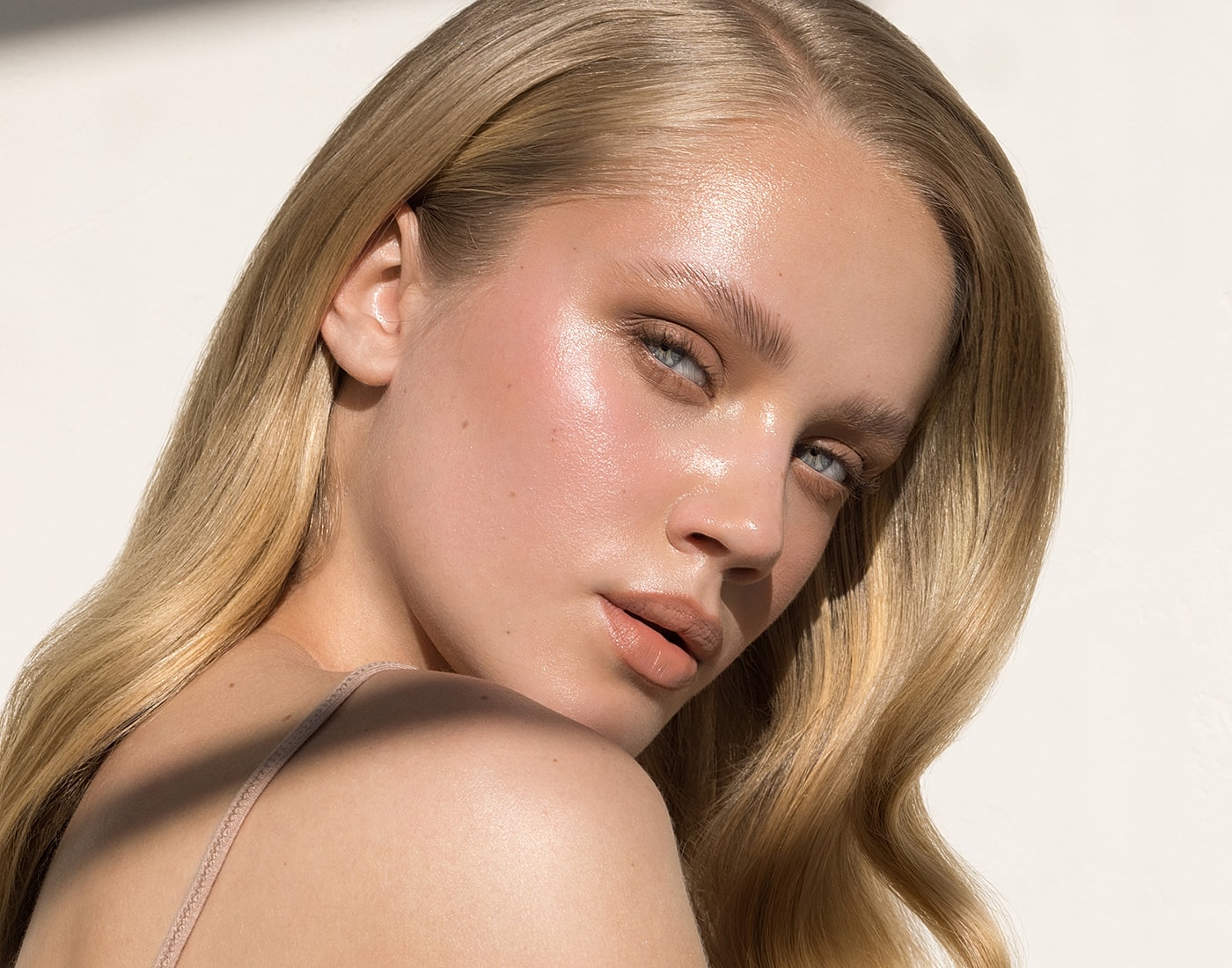 Portrait of a person with glowing complexion.